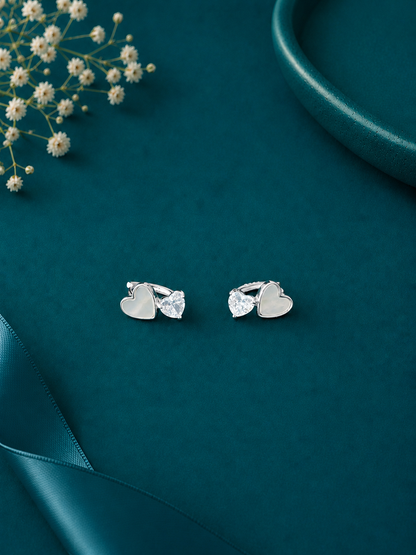 Elegant sterling silver heart stud earrings with sparkling crystal drops, perfect for adding a touch of charm to your everyday style.