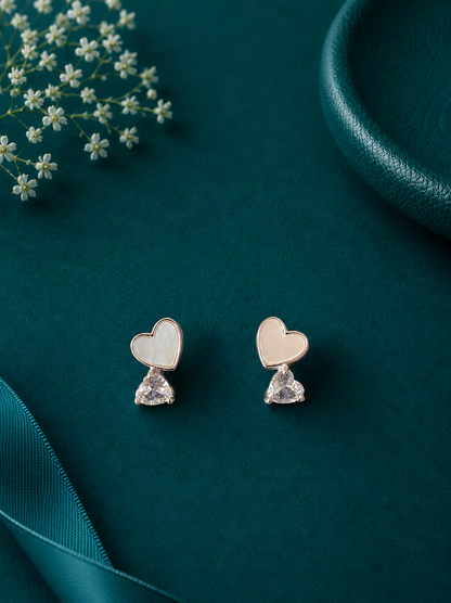 Elegant sterling silver heart stud earrings with sparkling crystal drops, perfect for adding a touch of charm to your everyday style.
